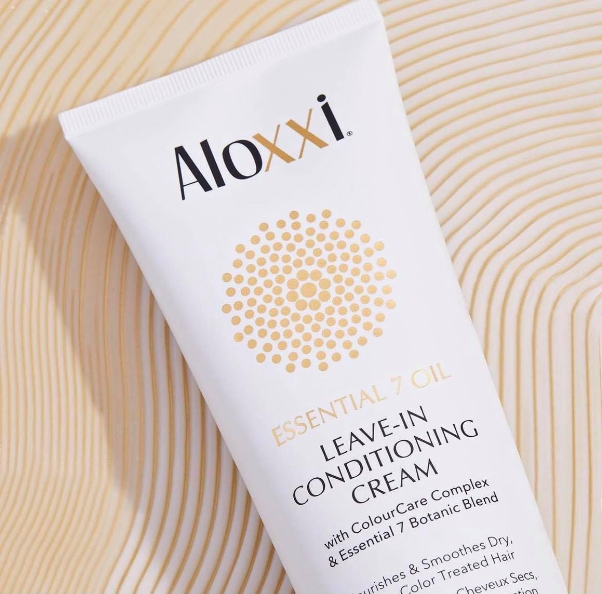 A tube of aloxxi leave in conditioning cream