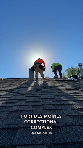 Roofing contractors installing shingles