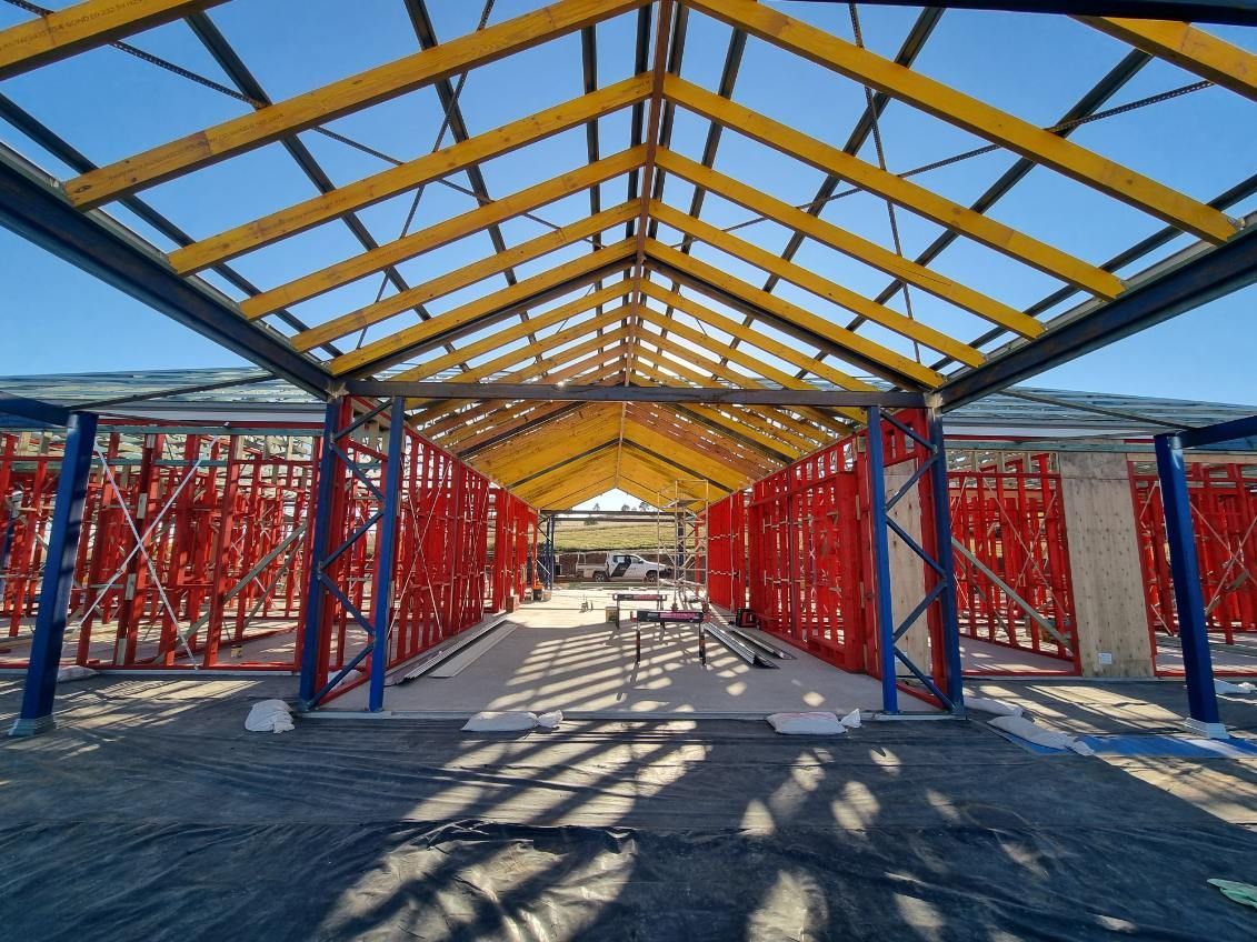 A House Is Being Built with A Wooden Roof — Trussframe in Westdale, NSW