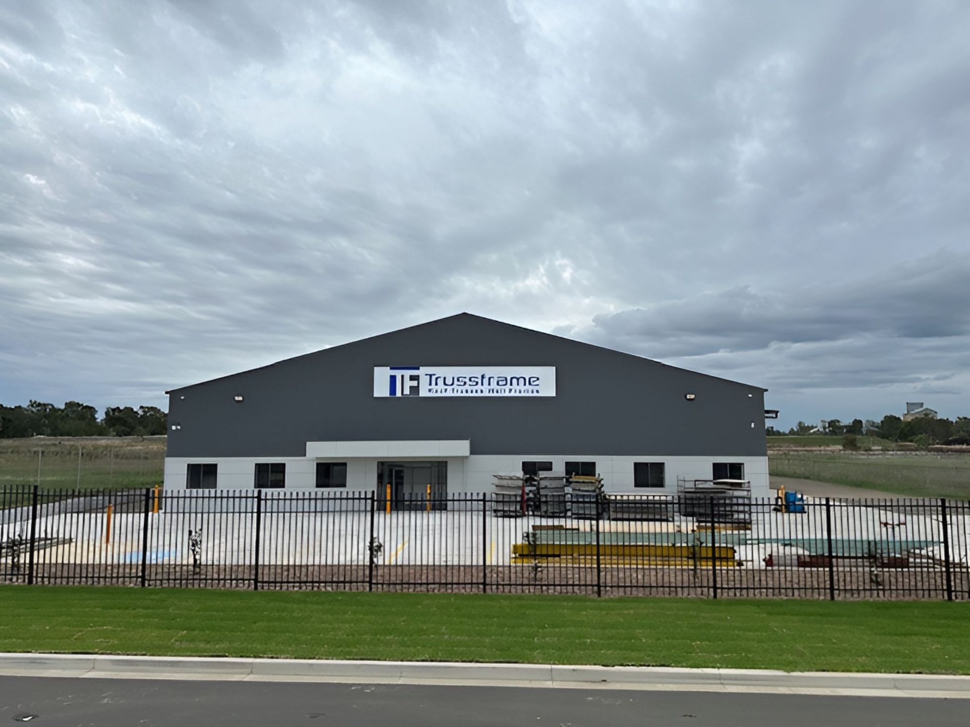 A Man Is Working on The Roof of A House — Trussframe in Westdale, NSW