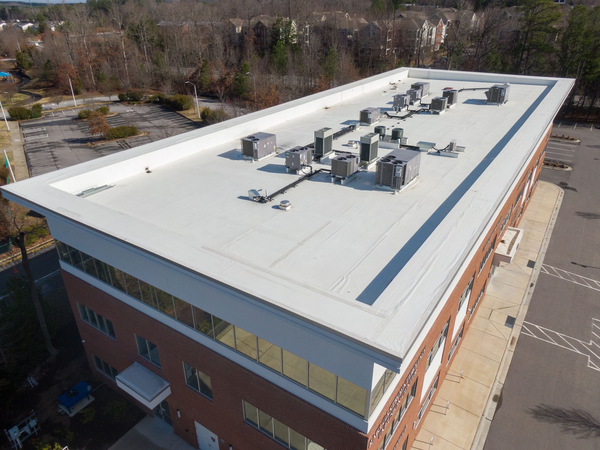 Commercial roof repair on a flat building roof with HVAC units. Commercial roof repair on a flat building roof with HVAC units.