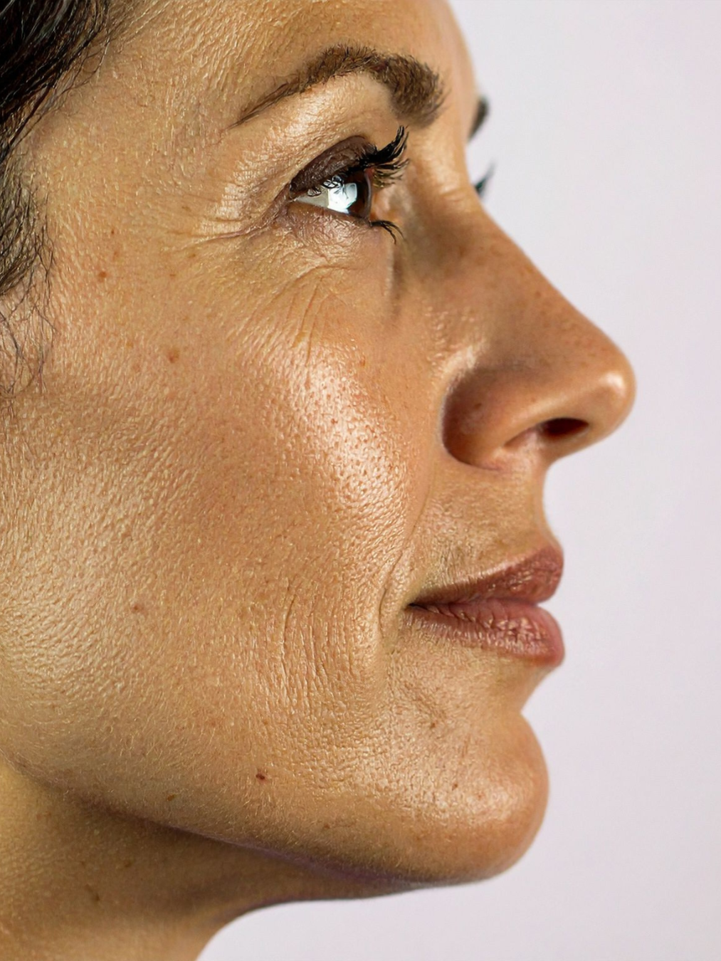 A close-up profile view of a face, focusing on skin texture, facial contours, and natural features — Skin Haven Aesthetics Whitsundays in Airlie Beach, QLD