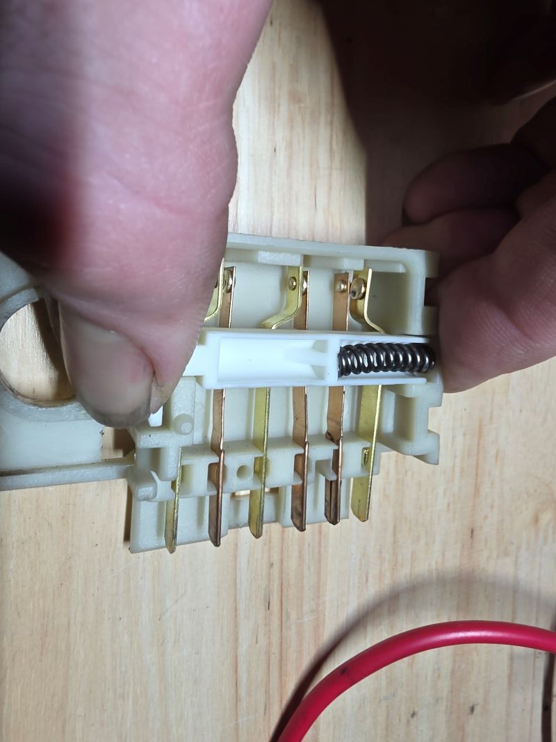 2005 Chevy Suburban brake switch component dissection showing shifted internal contact pin
