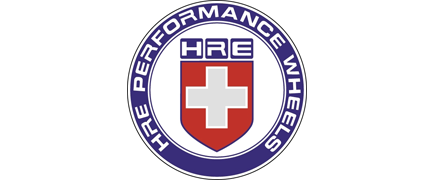 HRE Performance Wheels circular logo in blue, white, and red with a white cross shield at center