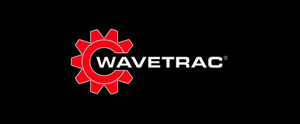 Wavetrac logo with red gear icon and white text on a black backgroundSilver and neon yellow sports car with oversized rear wing parked beside a white wall. | Pacific German