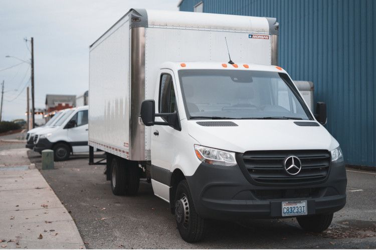 You might consider renting a covered moving truck