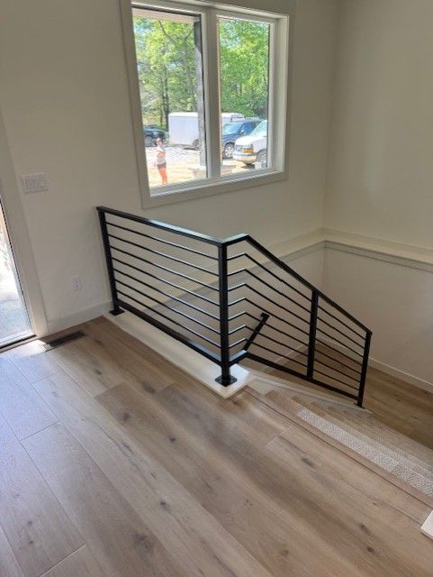 Custom Modern Interior Railings With Sleeved Wall Rail In Cedar Rapids, IA