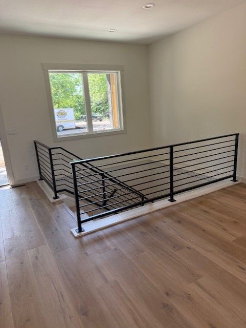 Custom Modern Interior Railings With Sleeved Wall Rail In Cedar Rapids, IA