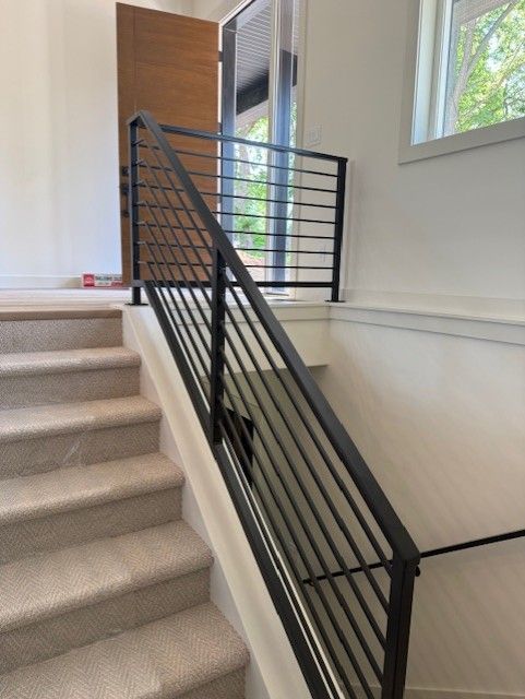 Custom Modern Interior Railings With Sleeved Wall Rail In Cedar Rapids, IA