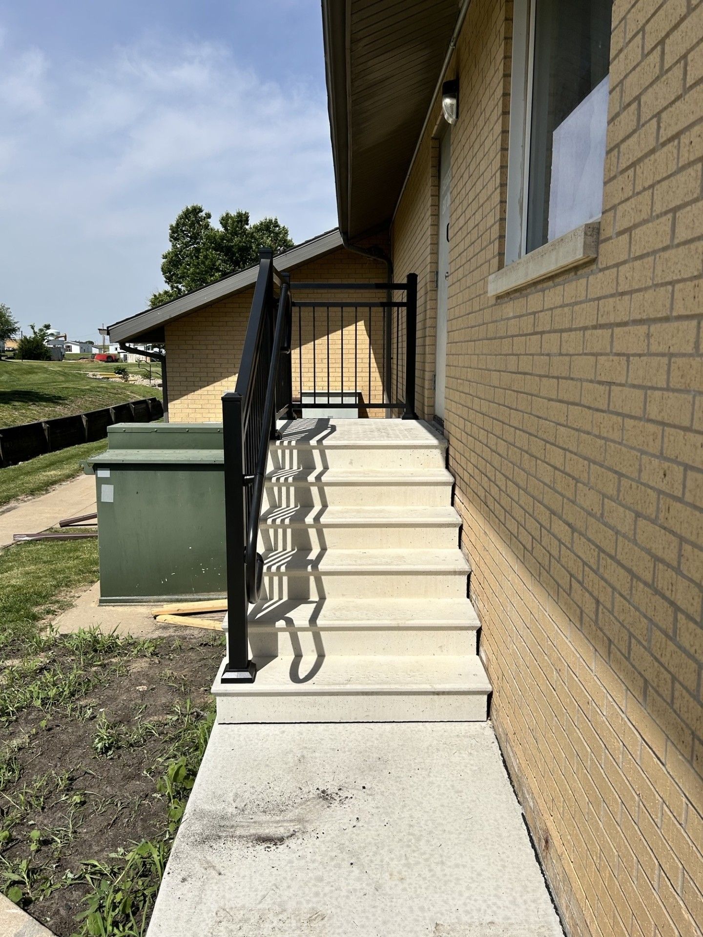 Aluminum Ultralox Railings With Mid Rail & Return Loops On New Precast Steps In Cedar Rapids, IA