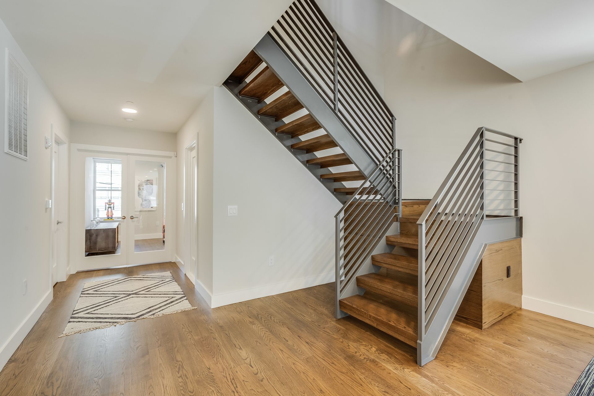 Modern staircase with metal railings Modern staircase with metal railings