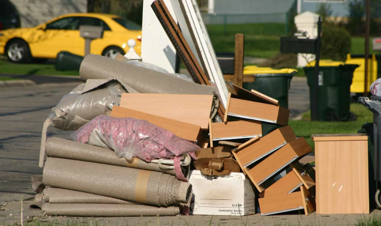 cabinets and carpets left outside