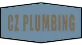Blue shield-shaped sign with “CZ PLUMBING” in brown lettering