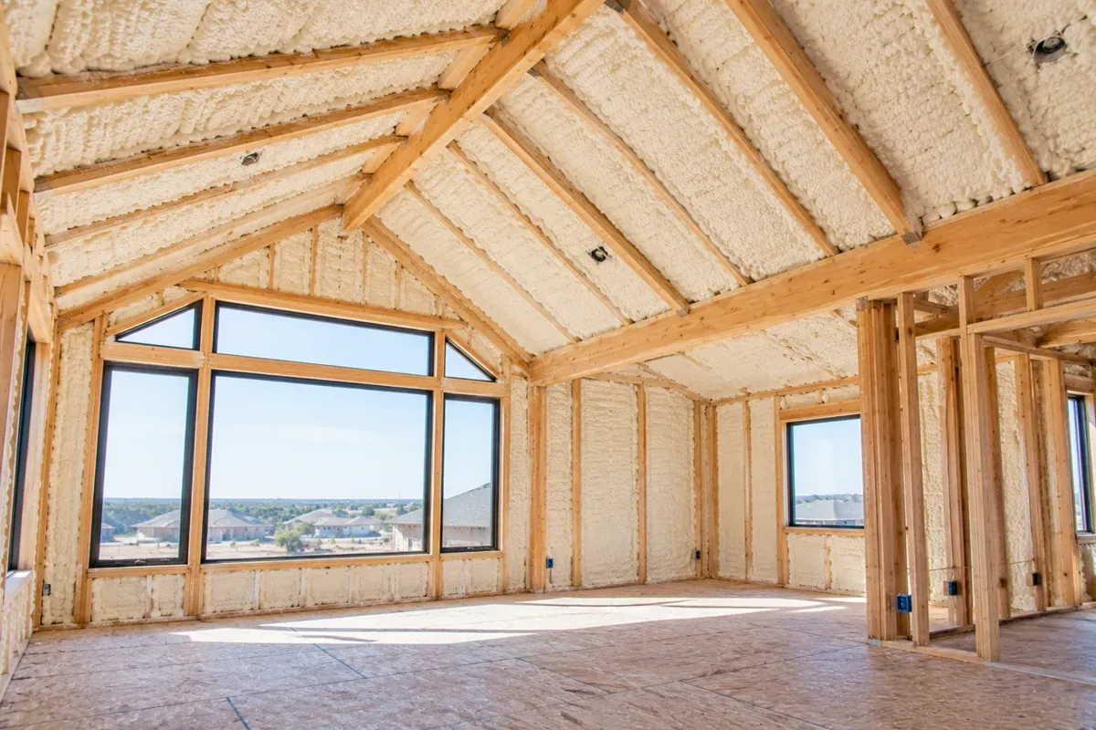 Completed open-cell spray foam insulation in a modern Odessa, TX home