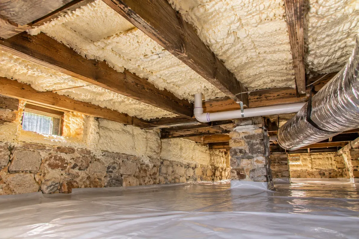 Completed crawl space spray foam insulation beneath an older Odessa home