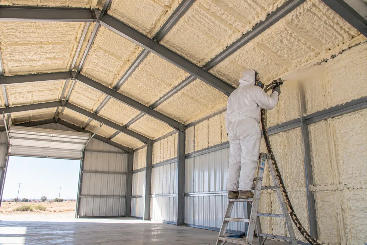 Spray foam insulation applied to a metal workshop ceiling in West Odessa, TX