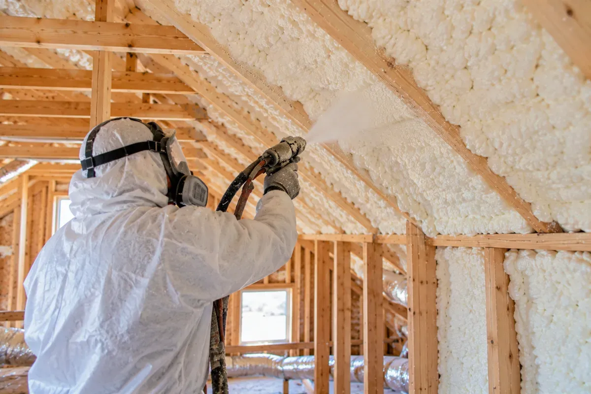 Open-cell spray foam insulation applied to attic rafters in Odessa, TX