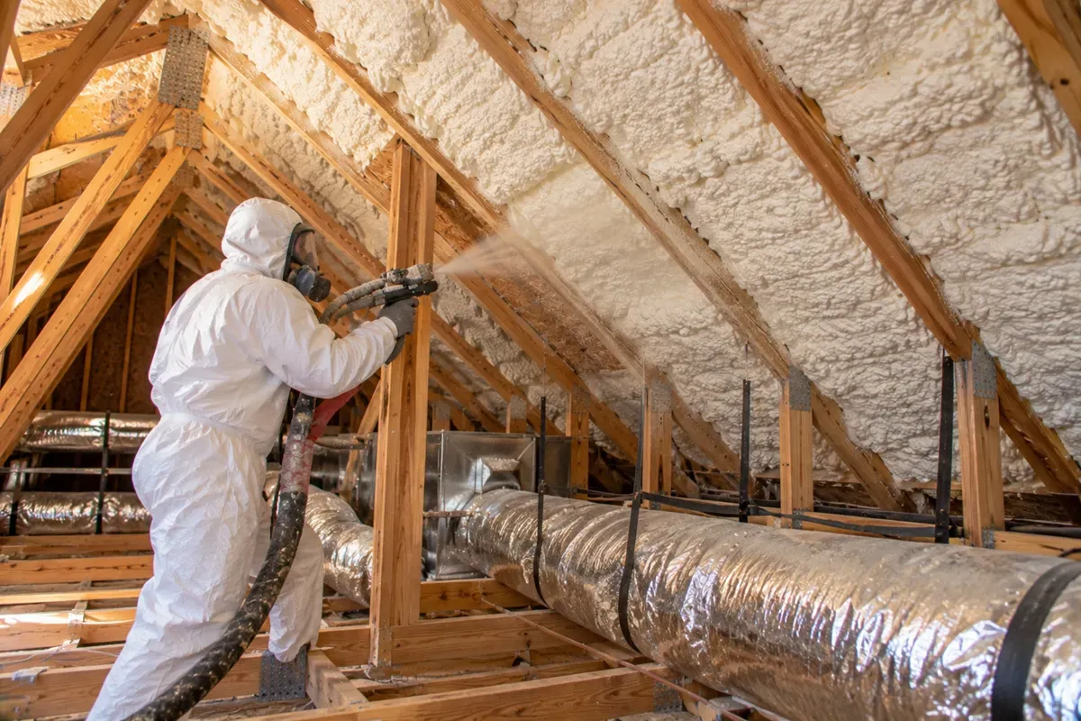 Open-cell spray foam applied to attic roof rafters in Midland, TX