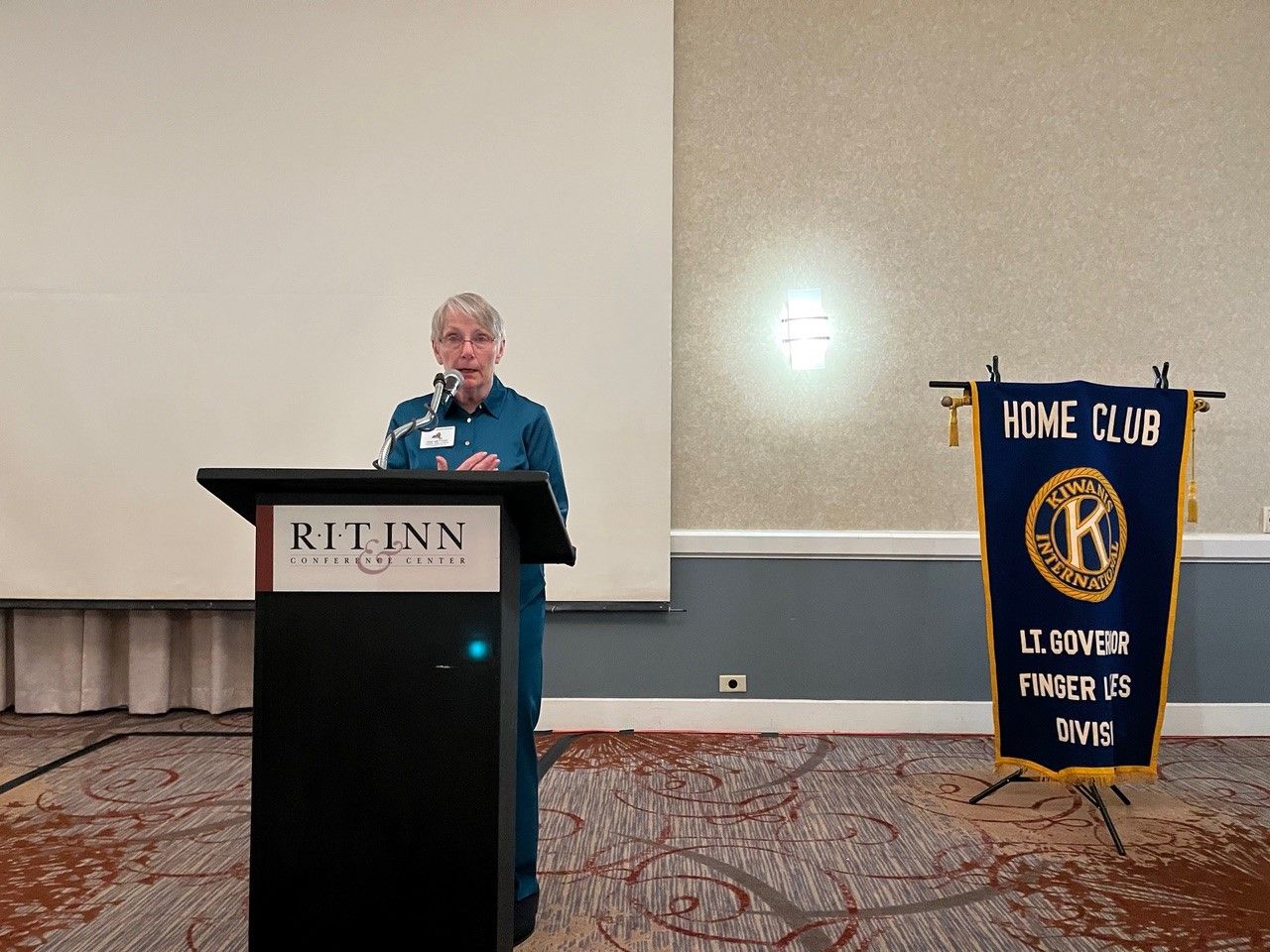 Woman standing at a podium