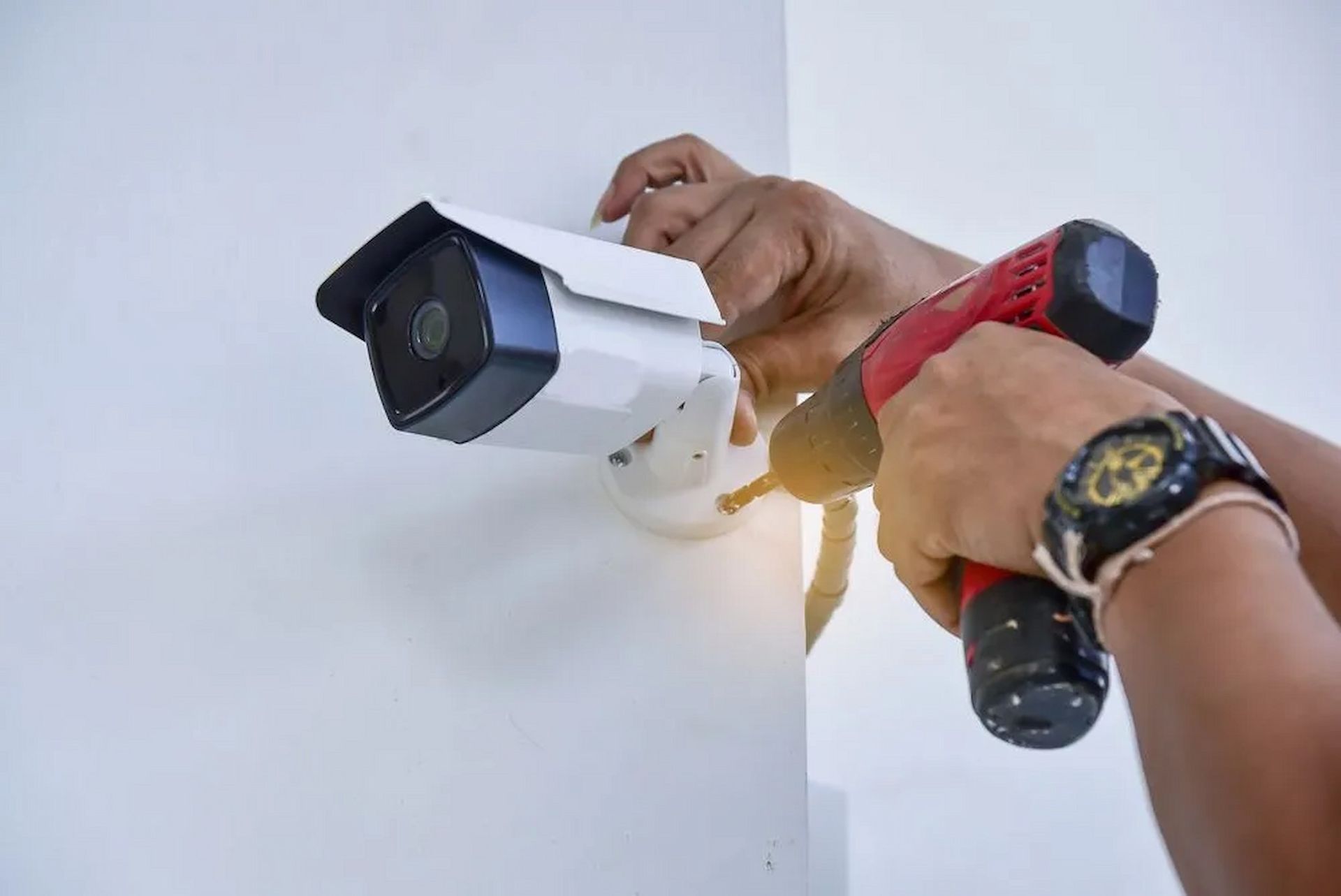 Technician Installing Security Cameras In Tamworth