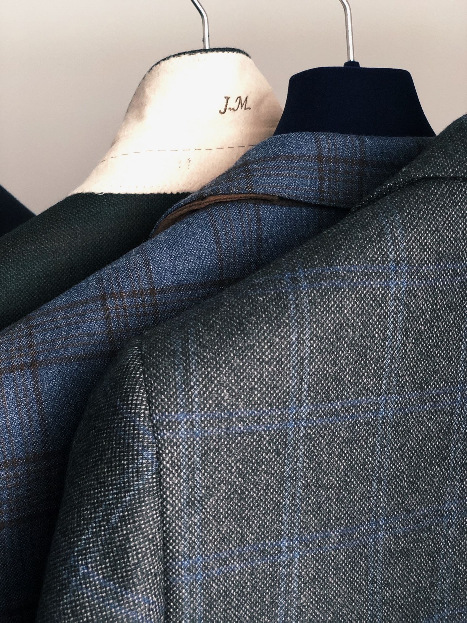 A close up of a jacket hanging on a hanger