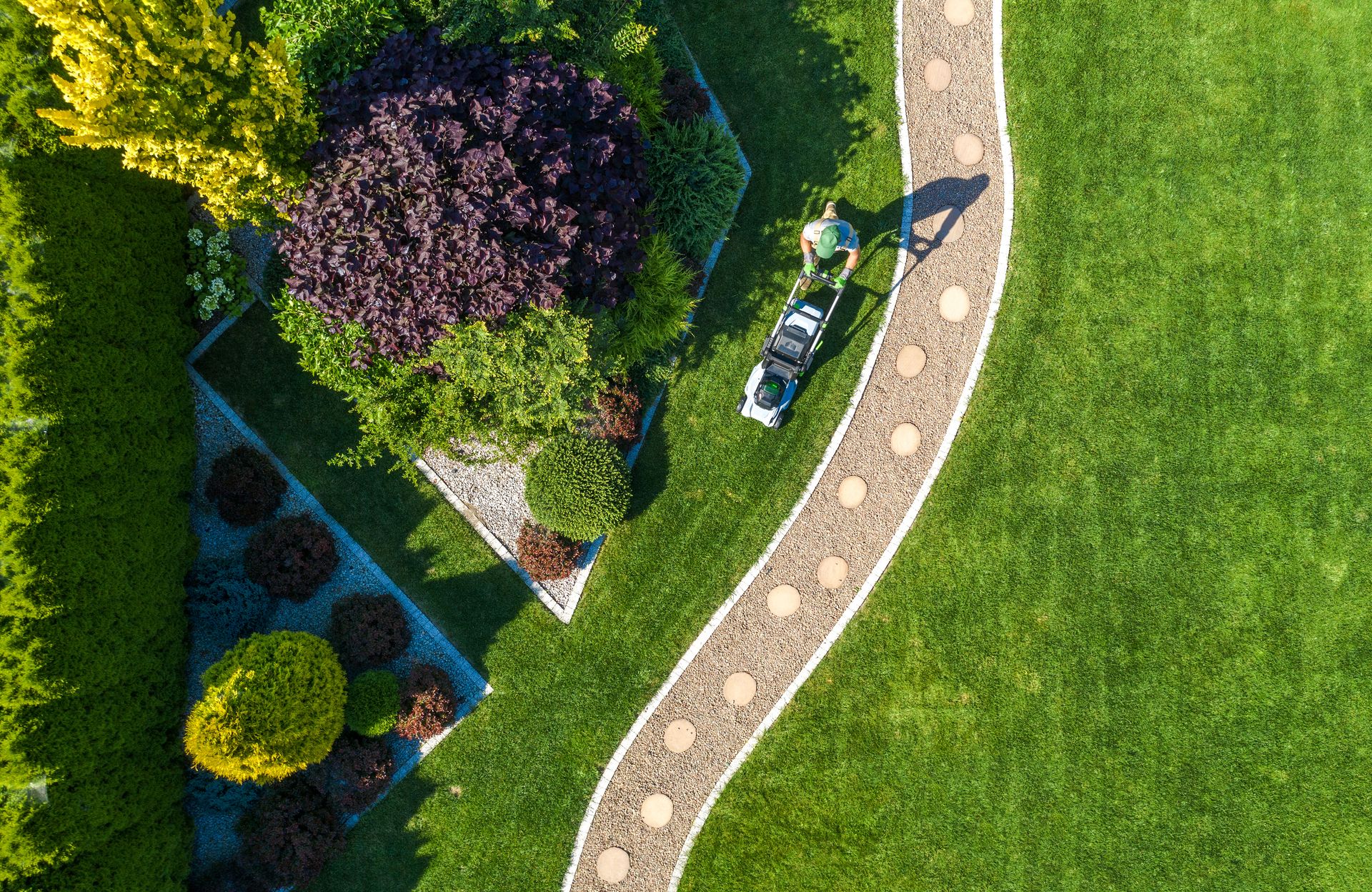 Gardener Mowing the Lawn