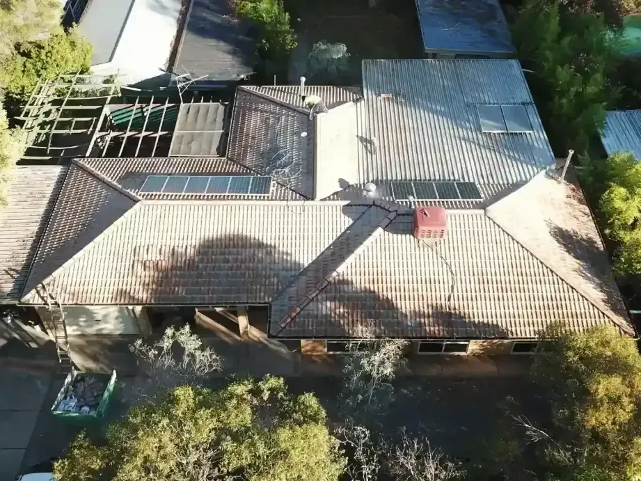 An aerial view of a house with a tiled roof