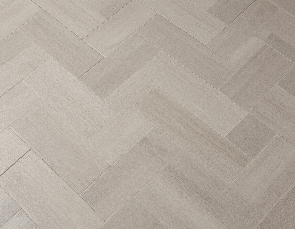 Large-format 12x24 porcelain floor tile in herringbone pattern