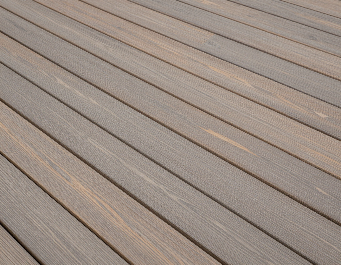 Composite deck boards in warm gray-brown with subtle grain