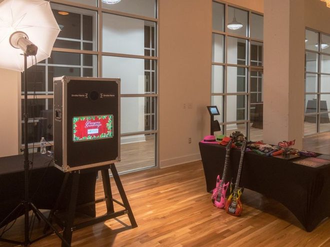 There is a photo booth in the middle of the room.