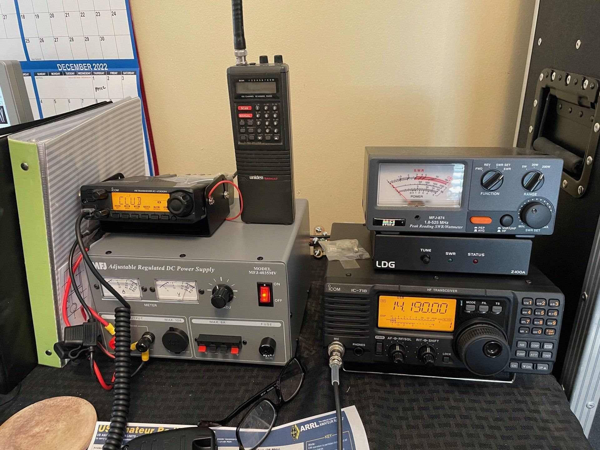 Several radios are sitting on a table including one that says lee