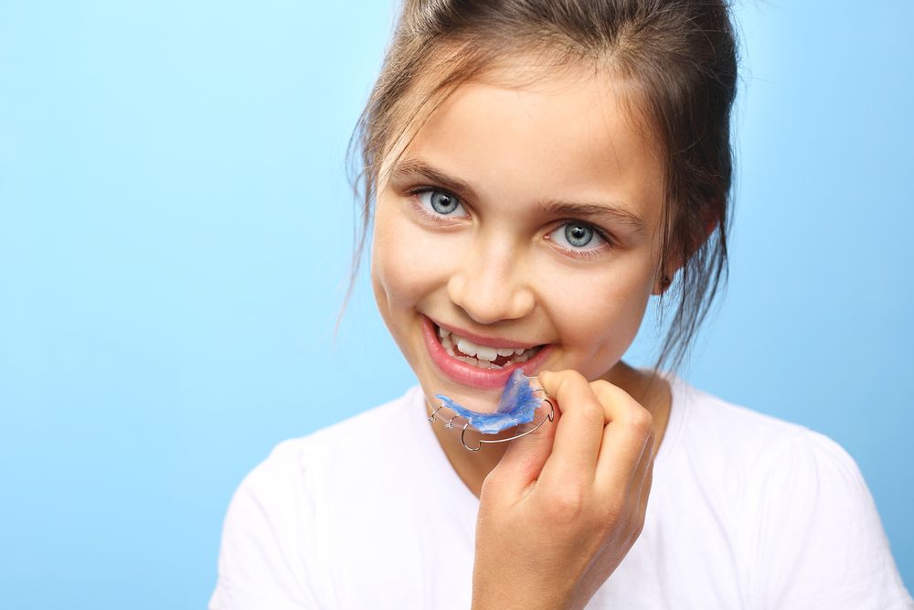 Girl With Bright Eyes Smiling — Tamworth Orthocare In Narrabri, NSW