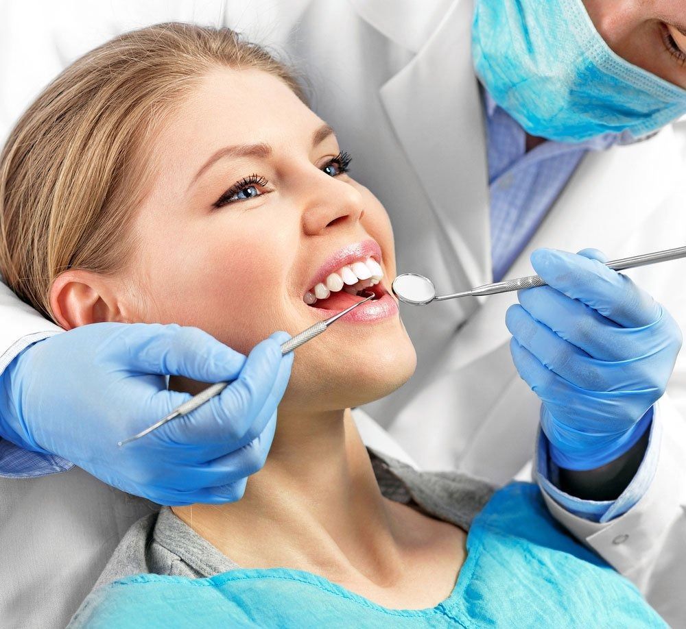 Woman at Dentist Appointment; Open Mouth — Tamworth Orthocare In Armidale, NSW