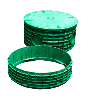A green, circular plastic septic tank riser with a matching lid and a separate extension ring.