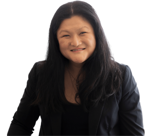 A woman with long black hair is smiling and wearing a black jacket