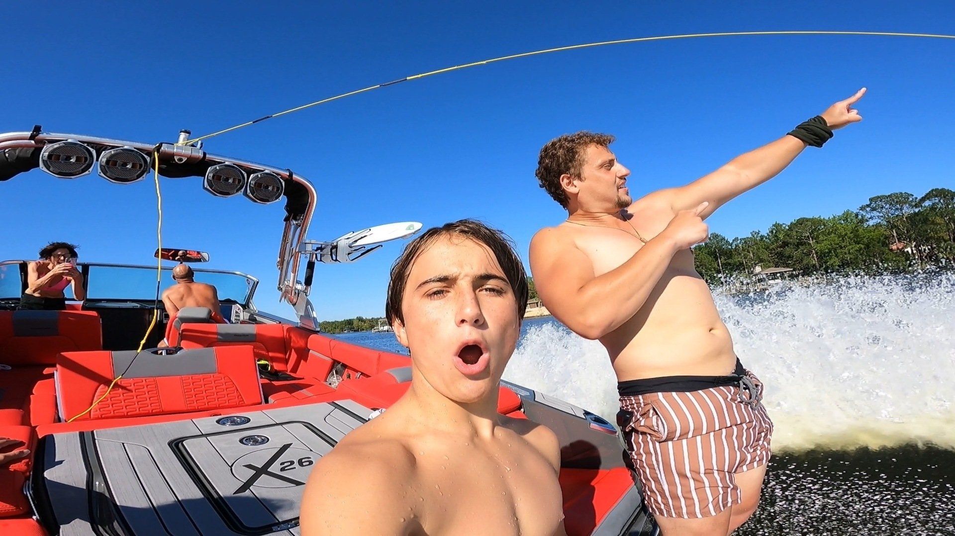 People taking selfie while riding on a boat