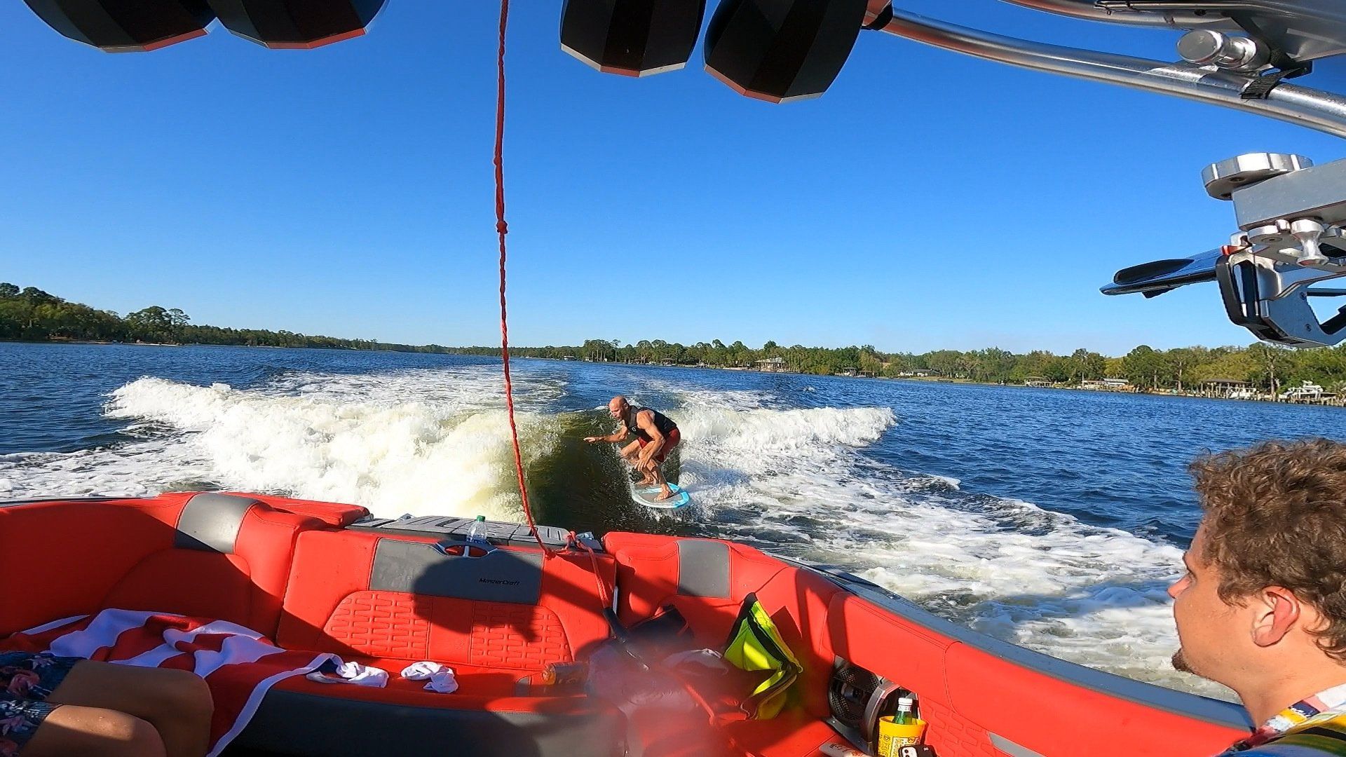 A group of people are riding a boat on a lake.