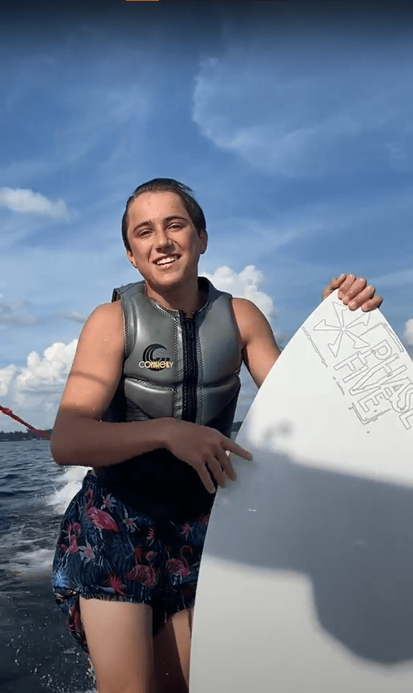 person posing with wakesurf board