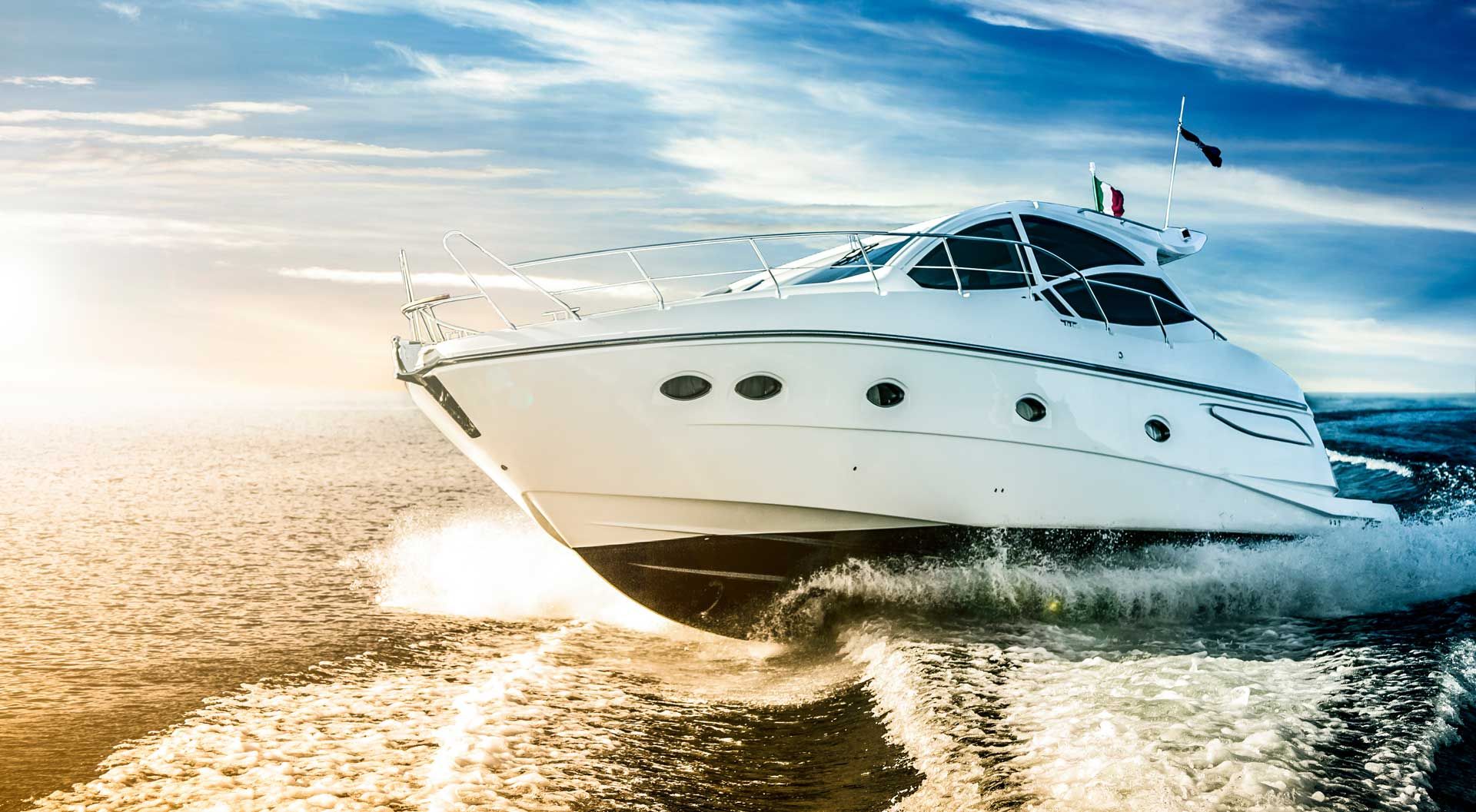 White motorboat speeding across the water, sunlit sky, splashing waves. White motorboat speeding across the water, sunlit sky, splashing waves.