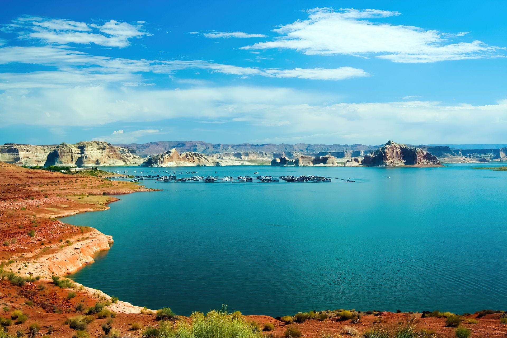 A large body of water surrounded by rocks and mountains.