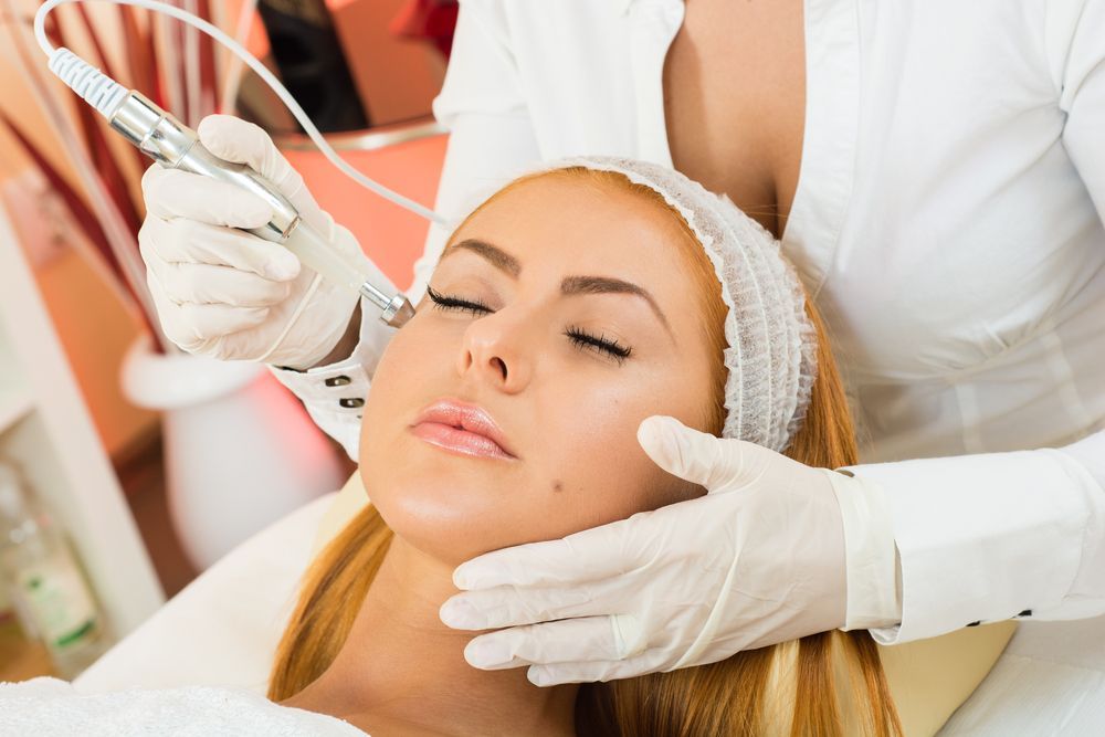 Facial Treatment With Gloved Hands Using a Skin Tool — A9 Skin and Hair Clinic In Westmead, NSW