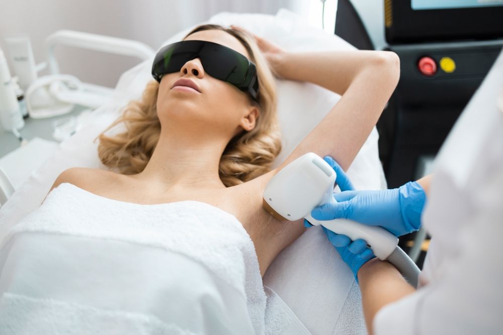 Woman Receiving Laser Treatment on Her Arm — A9 Skin and Hair Clinic In Westmead, NSW