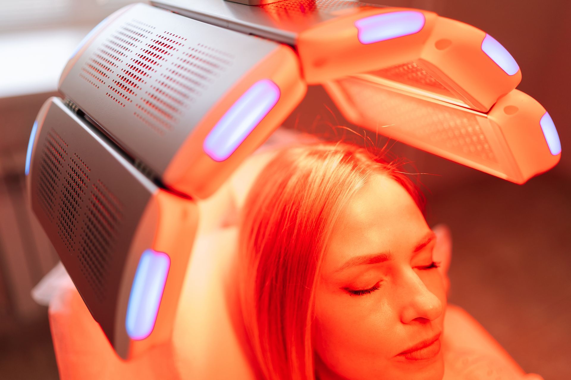 Woman Under Red Light Hair Therapy — A9 Skin and Hair Clinic In Westmead, NSW