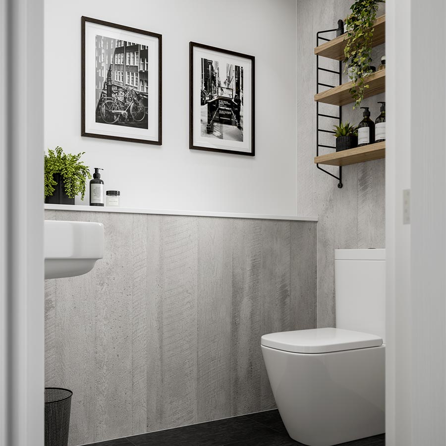Modern bathroom with a toilet, sink, and decorative shelves; black and white photography on the wall.