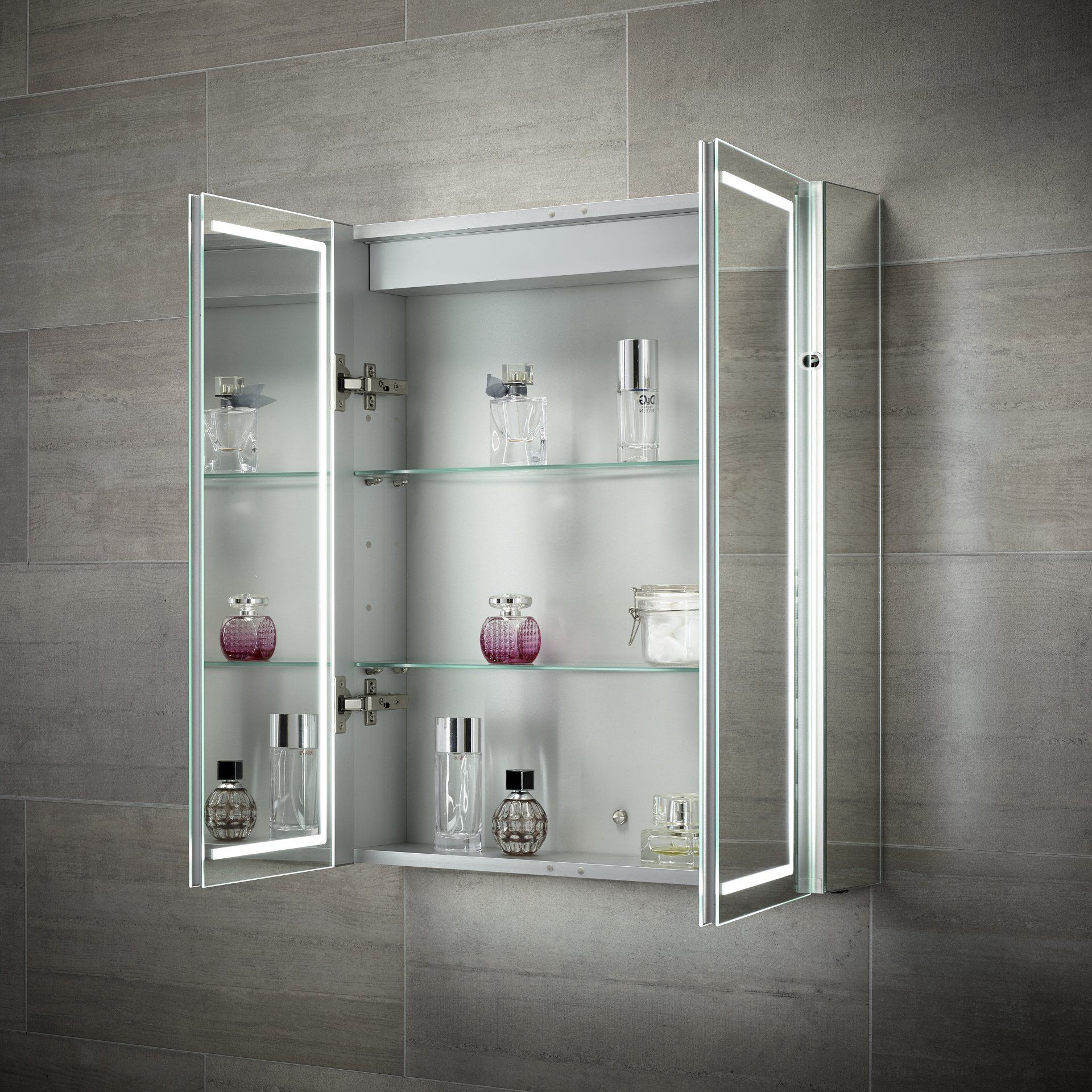 Bathroom medicine cabinet with mirrored doors and LED lighting, open to reveal toiletries.