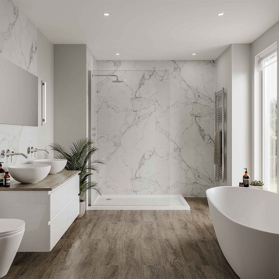 Bathroom with marble shower, wooden floor, white vanity with sinks, and free-standing tub.