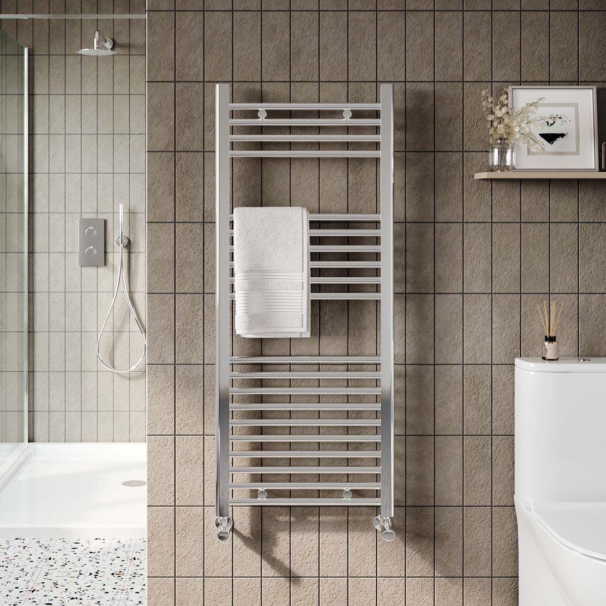 Modern bathroom with tiled wall, towel radiator, bathtub edge, and white sink.