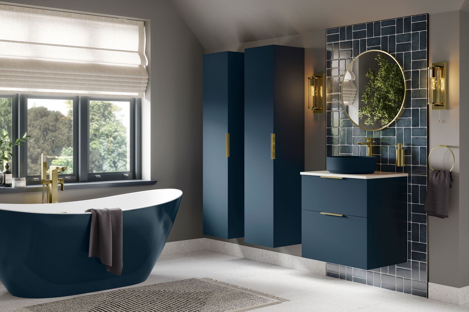 Elegant blue bathroom with freestanding tub, vanity, and storage cabinets.
