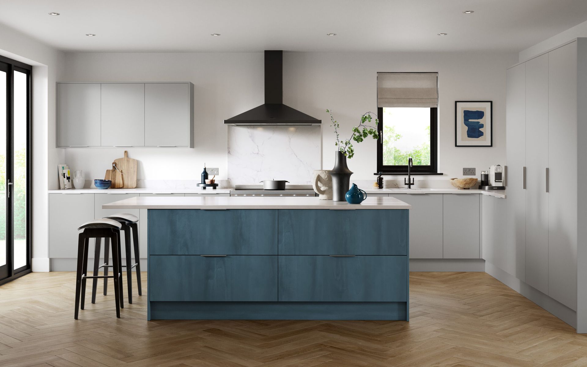Modern kitchen with blue island, white cabinets, and wooden floor.