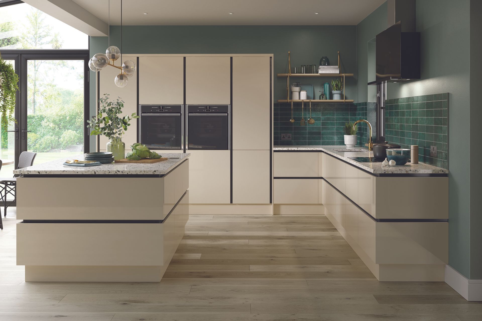 Modern cream kitchen with black accents, island, and U-shaped counters; green backsplash.